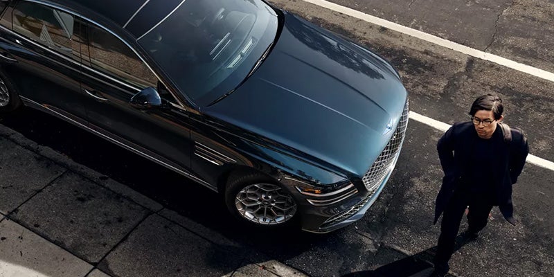 2024 Genesis G80 with man walking